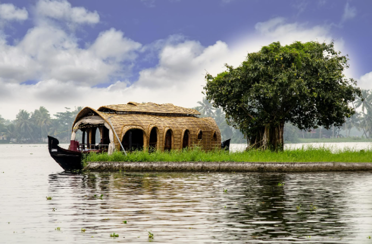 Traditional Kerala houseboat cruising through the scenic Alleppey backwaters